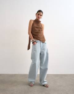 Model wearing Super soft cupro halter neck in chocolate