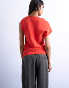 Model wearing Super soft cupro knot detail top in red