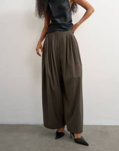 Model wearing Super wide leg trouser in chocolate stripe
