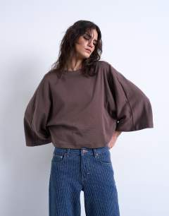 Model wearing Super wide sleeve tee in chocolate