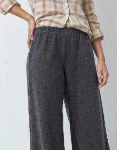Model wearing Supersoft pleated wide leg joggers in charcoal