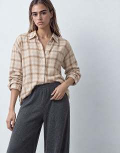Model wearing Supersoft pleated wide leg joggers in charcoal