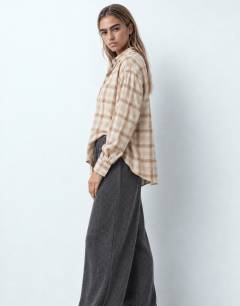 Model wearing Supersoft pleated wide leg joggers in charcoal