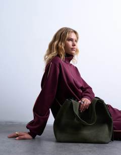 Model wearing Suri real suede leather shoulder bag in khaki