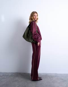 Model wearing Suri real suede leather shoulder bag in khaki