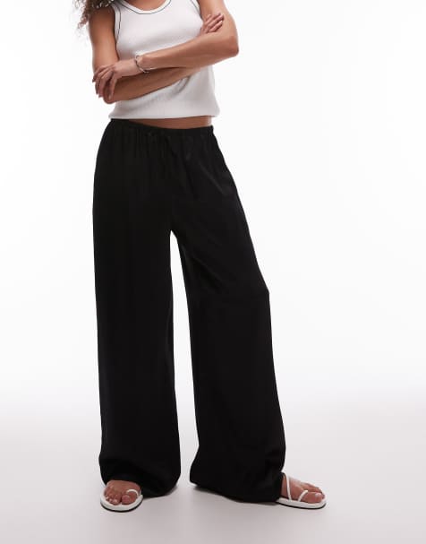 Topshop – Svarta, vida byxor i satin med knytning i midjan - view 1