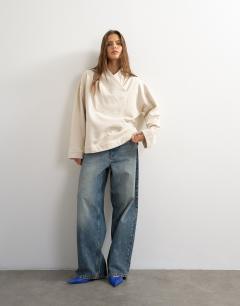Model wearing Sweat high neck cross over jumper in stone