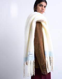 Model wearing Sydney blanket scarf in beige