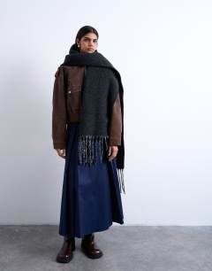 Model wearing Sydney blanket scarf in black & grey