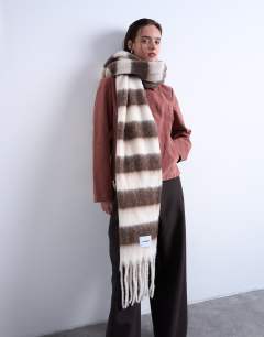 Model wearing Sydney blanket scarf in brown & white stripe