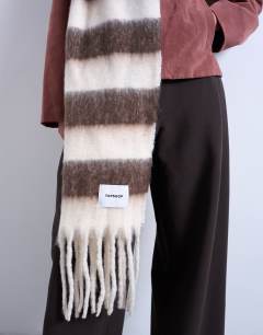 Model wearing Sydney blanket scarf in brown & white stripe
