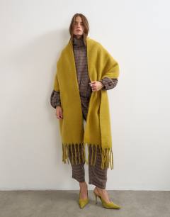 Model wearing Sydney blanket scarf in chartreuse