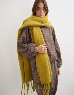 Model wearing Sydney blanket scarf in chartreuse