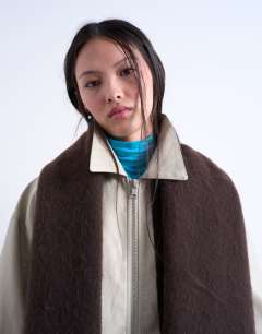 Model wearing Sydney blanket scarf in chocolate