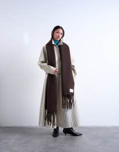 Model wearing Sydney blanket scarf in chocolate