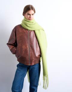 Model wearing Sydney blanket scarf in green