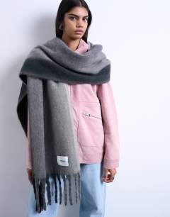 Model wearing Sydney blanket scarf in grey