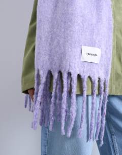 Model wearing Sydney blanket scarf in lilac