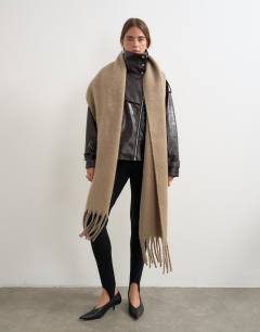Model wearing Sydney blanket scarf in mink