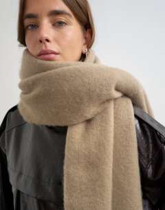 Model wearing Sydney blanket scarf in mink