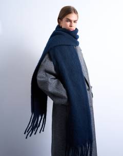 Model wearing Sydney blanket scarf in navy
