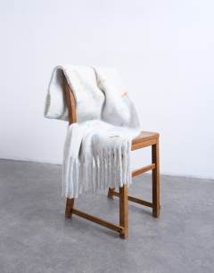 Model wearing Sydney blanket scarf in off white