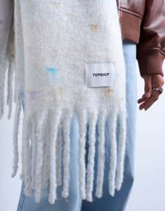 Model wearing Sydney blanket scarf in off white
