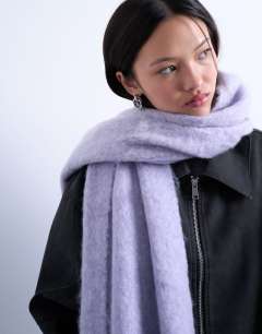 Model wearing Sydney blanket scarf in purple stripe