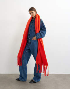 Model wearing Sydney blanket scarf in red