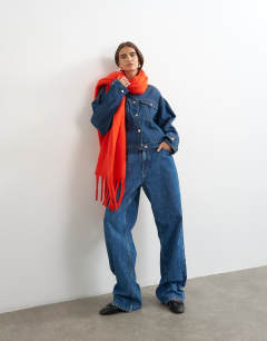 Model wearing Sydney blanket scarf in red