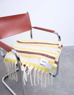 Model wearing Sydney blanket scarf in yellow, burg & blue stripe