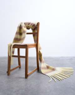 Model wearing Sydney striped blanket scarf in green & brown