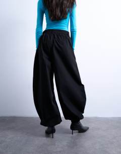 Model wearing Tab detail oversized balloon trouser in black