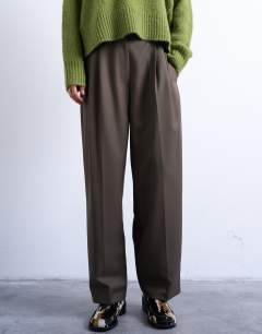 Model wearing Tab detail slouchy wide leg trouser in olive