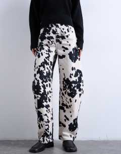 Model wearing Tab waist balloon trouser in cow print