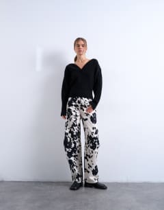 Model wearing Tab waist balloon trouser in cow print