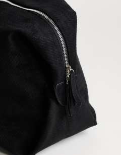 Model wearing Tabby suedette weekend bag in black weave