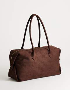 Model wearing Tabby suedette weekend bag in chocolate weave