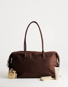 Model wearing Tabby suedette weekend bag in chocolate weave