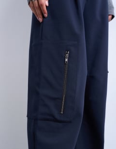 Model wearing Tailored barrel leg cargo trouser in navy
