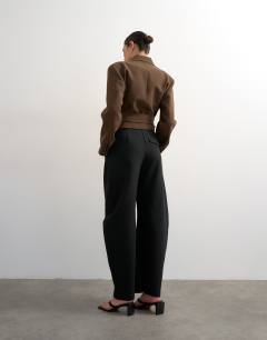 Model wearing Tailored barrel trouser in black