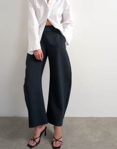 Model wearing Tailored barrel trouser in navy