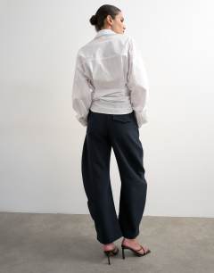 Model wearing Tailored barrel trouser in navy