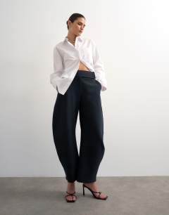 Model wearing Tailored barrel trouser in navy