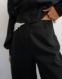 Model wearing Tailored bubble barrel leg trouser in black