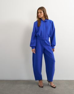 Model wearing Tailored bubble barrel leg trouser in blue