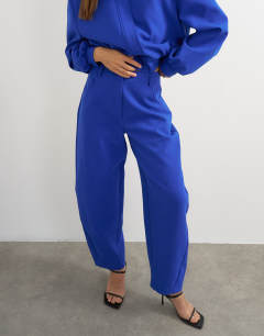 Model wearing Tailored bubble barrel leg trouser in blue