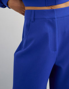 Model wearing Tailored bubble barrel leg trouser in blue