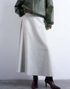 Model wearing Tailored full circle a line maxi skirt in grey