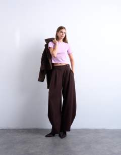 Model wearing Tailored horseshoe leg trouser in chocolate